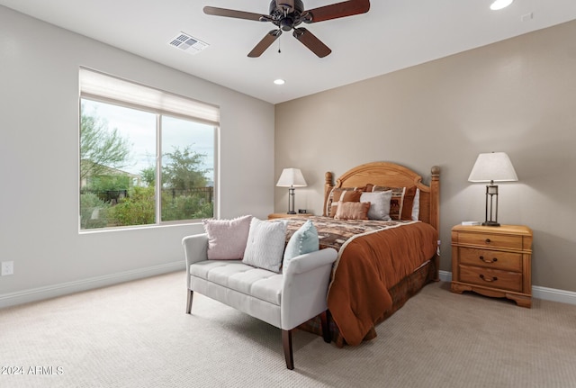 bedroom featuring ceiling fan and light colored carpet