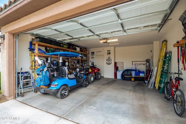 garage featuring a garage door opener