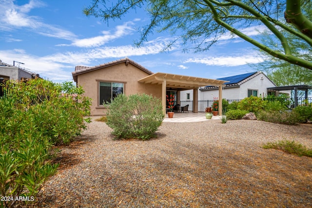 view of front of home featuring a pergola and a patio