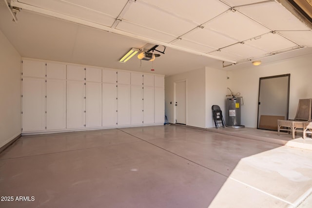 garage with water heater and a garage door opener