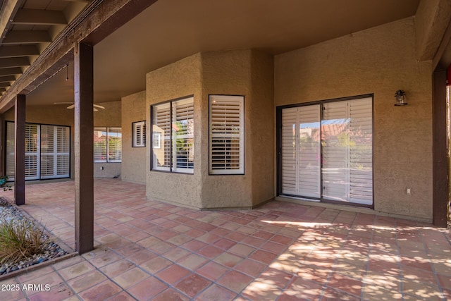 view of patio featuring ceiling fan