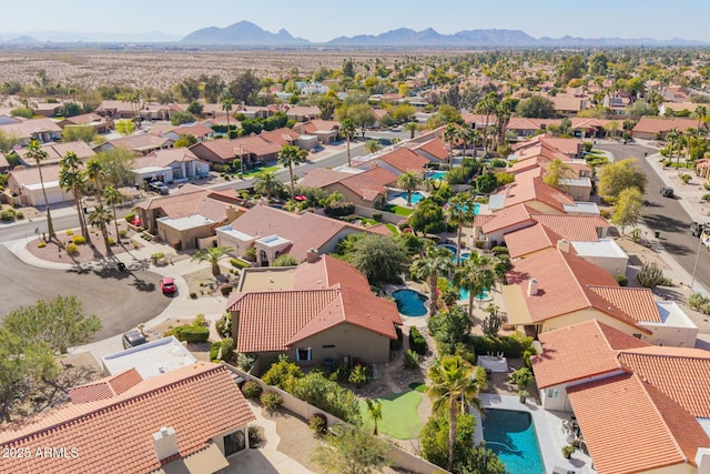 birds eye view of property with a mountain view