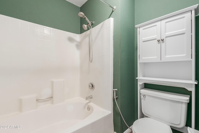 bathroom featuring tub / shower combination and toilet