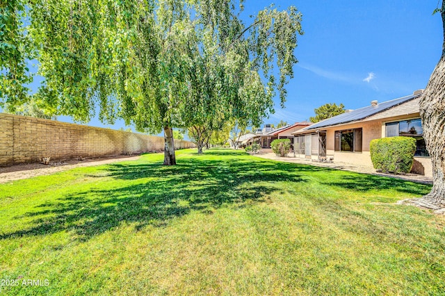 view of yard with a patio and fence
