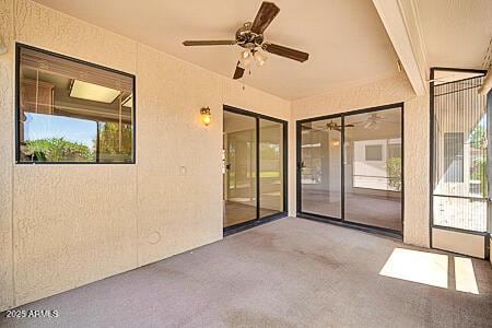 exterior space featuring ceiling fan
