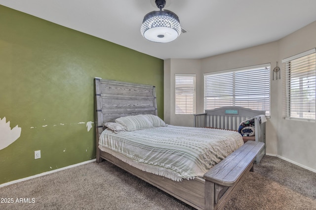 bedroom with carpet flooring and baseboards