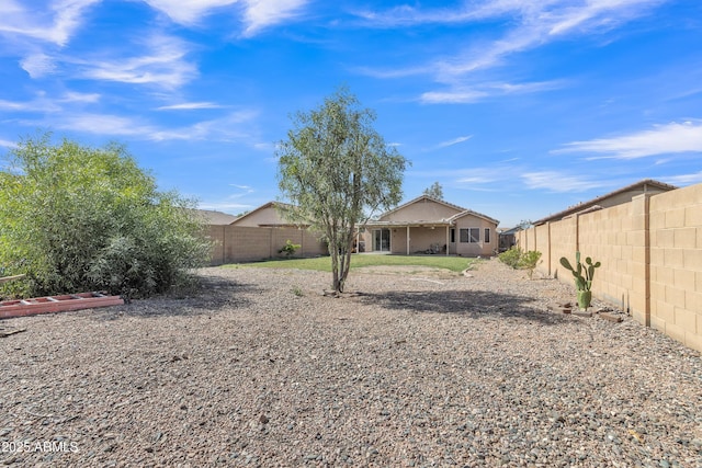 exterior space with a fenced backyard