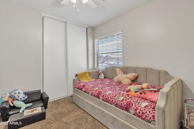 bedroom featuring carpet, a closet, and ceiling fan
