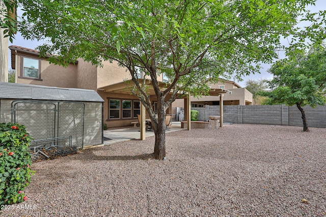 view of yard with fence and a patio area