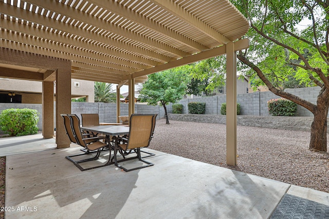 view of patio featuring outdoor dining space, a fenced backyard, and a pergola