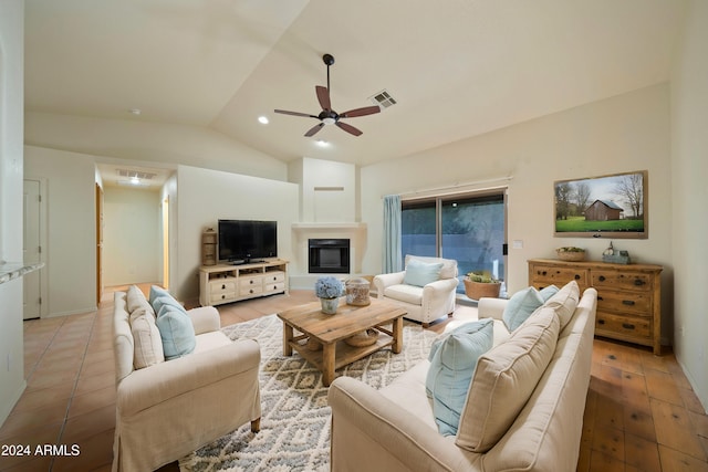 living room featuring hardwood / wood-style floors, vaulted ceiling, and ceiling fan