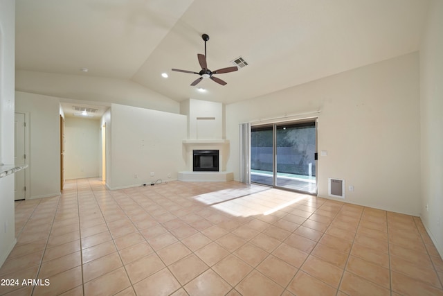 unfurnished living room with light tile patterned floors, vaulted ceiling, and ceiling fan