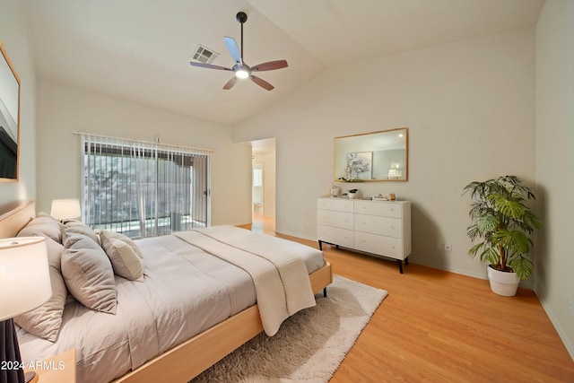 bedroom with vaulted ceiling, ceiling fan, and light wood-type flooring