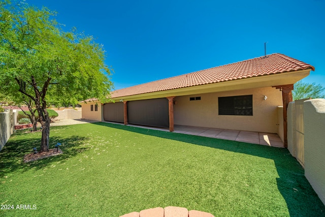 back of property with a patio