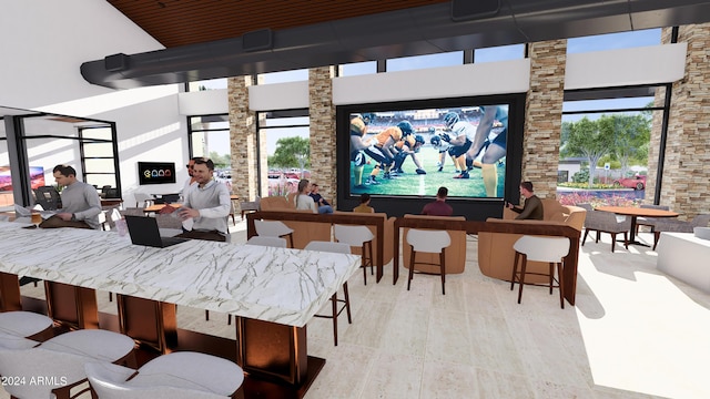 dining area featuring a high ceiling