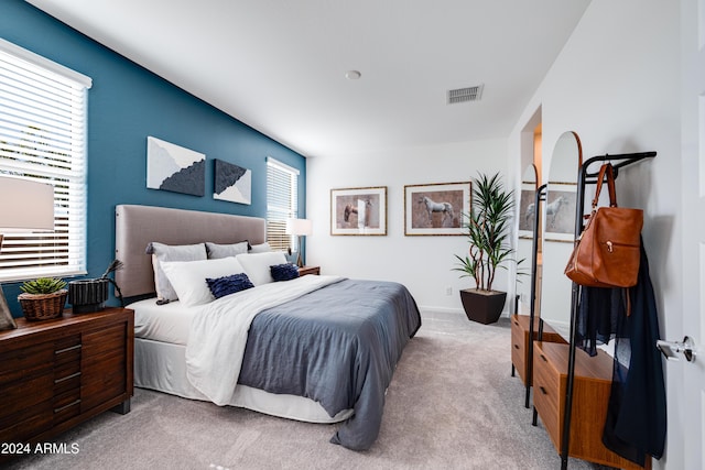 bedroom with light colored carpet