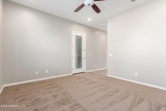 empty room featuring carpet and ceiling fan