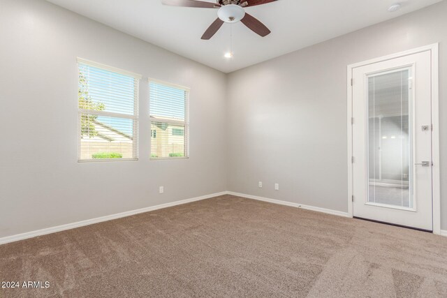 unfurnished room featuring carpet flooring and ceiling fan