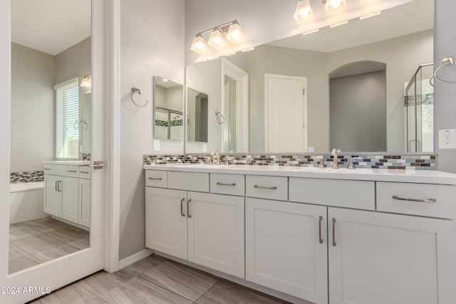 bathroom with decorative backsplash and vanity