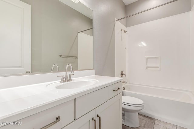 full bathroom with tile patterned floors, vanity, shower / tub combination, and toilet