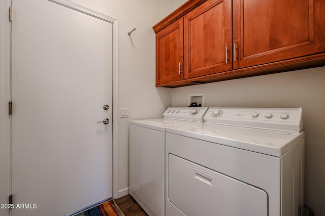 washroom featuring cabinets and independent washer and dryer