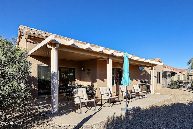 rear view of property with a patio