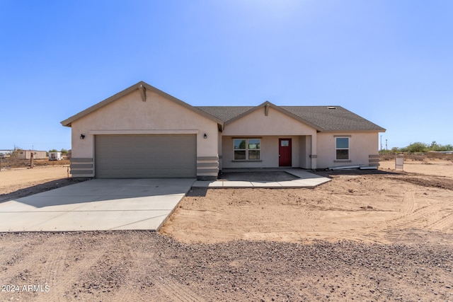 single story home featuring a garage