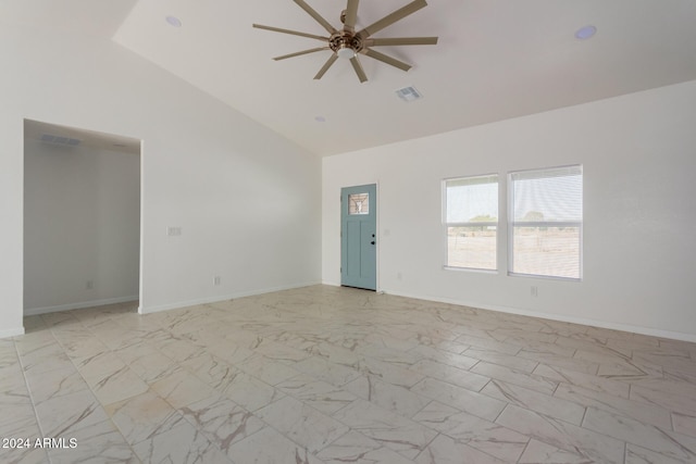 unfurnished living room with ceiling fan and high vaulted ceiling