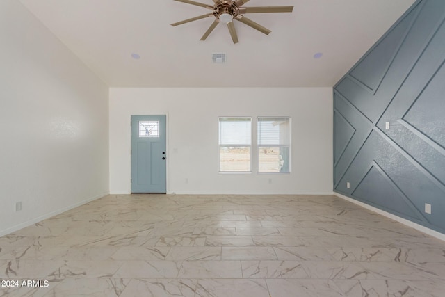 interior space with ceiling fan