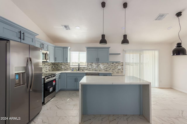 kitchen featuring backsplash, appliances with stainless steel finishes, vaulted ceiling, sink, and decorative light fixtures