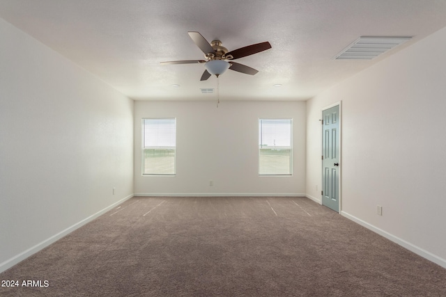 empty room with light carpet and ceiling fan