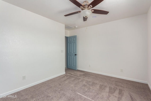 empty room with light colored carpet and ceiling fan