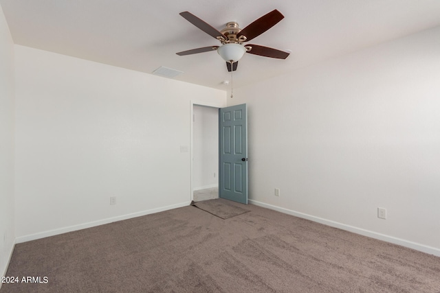 empty room with carpet floors and ceiling fan