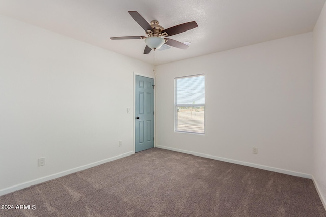 unfurnished room with ceiling fan and carpet floors