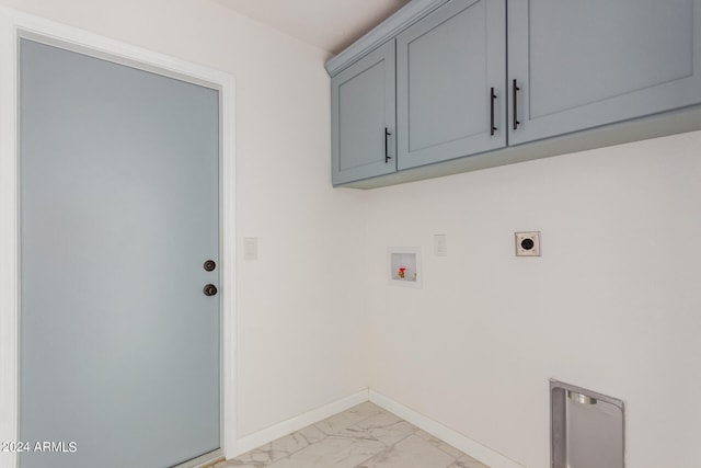 laundry room featuring hookup for a washing machine, electric dryer hookup, and cabinets