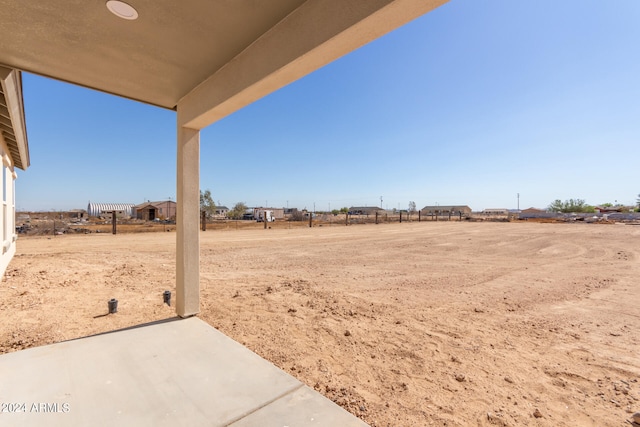 view of yard with a rural view