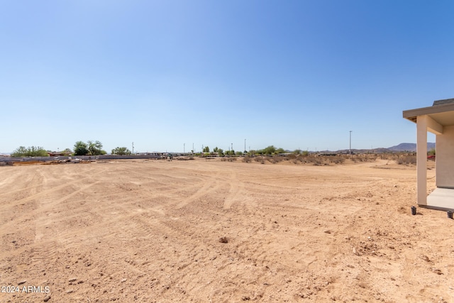 view of yard with a rural view