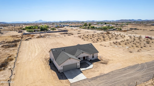 drone / aerial view featuring a mountain view