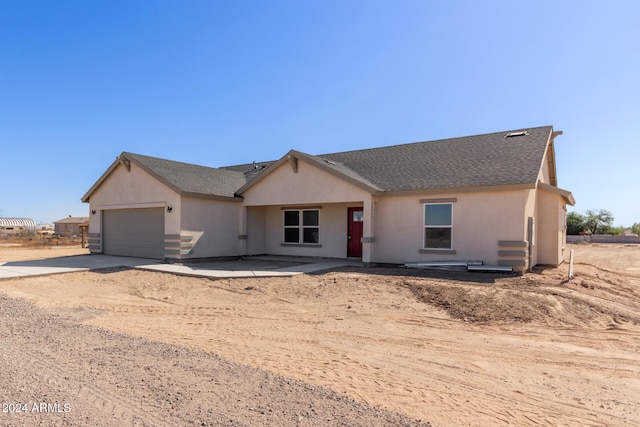 ranch-style home featuring a garage