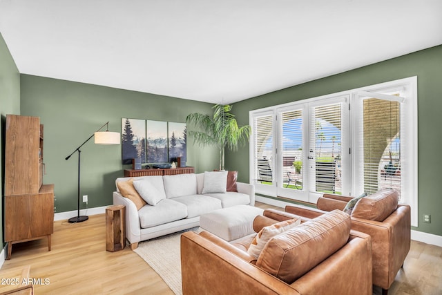 living room featuring wood finished floors and baseboards