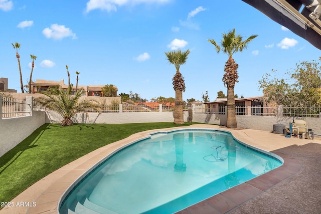 view of pool featuring a fenced in pool, a lawn, and a fenced backyard