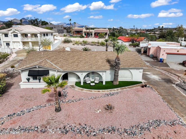 view of front of home featuring a residential view and driveway