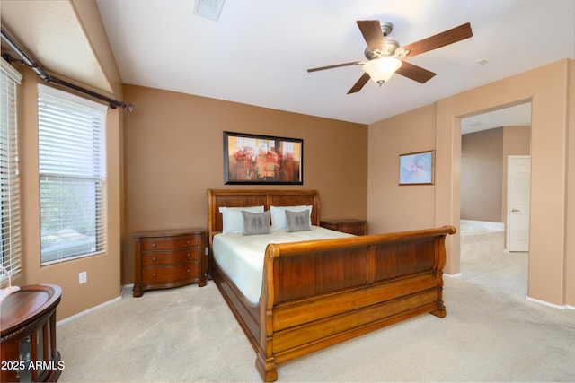 bedroom with baseboards, light colored carpet, visible vents, and ceiling fan