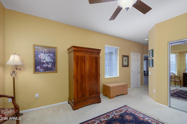 carpeted bedroom with baseboards and a ceiling fan