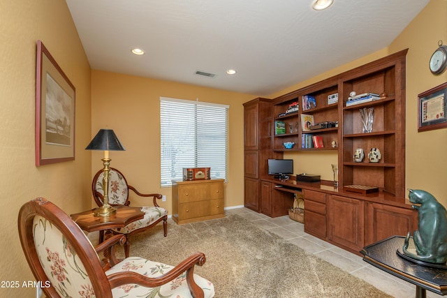 home office featuring light tile patterned floors, visible vents, built in study area, recessed lighting, and light carpet