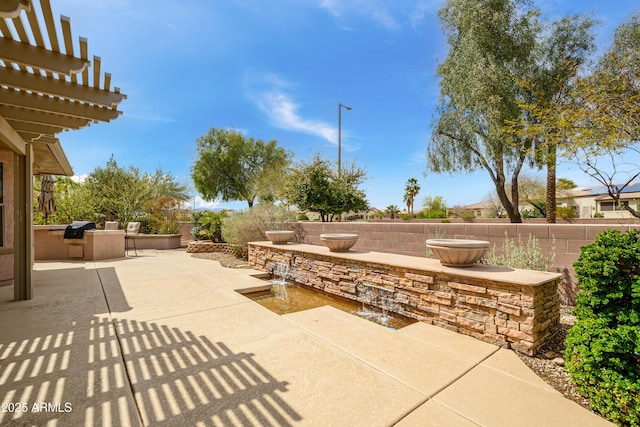 view of patio / terrace featuring grilling area, area for grilling, a pergola, and fence