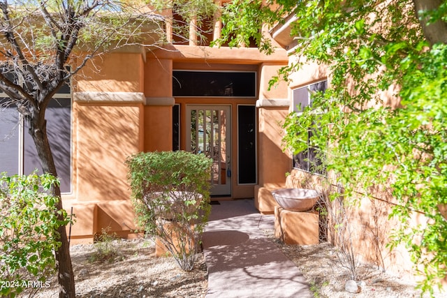 entrance to property featuring french doors