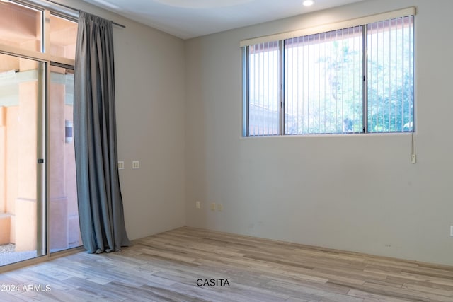 15972 N 115th Way, Scottsdale, AZ 85255 - unfurnished room featuring wood finished floors