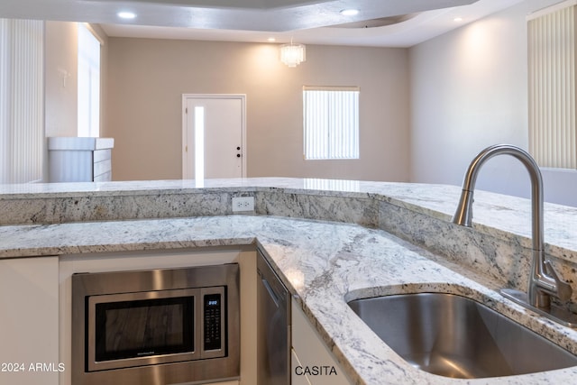 15972 N 115th Way, Scottsdale, AZ 85255 - kitchen view of a sink, stainless steel microwave, recessed lighting, and light stone counters