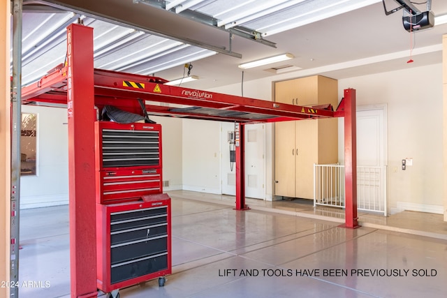 15972 N 115th Way, Scottsdale, AZ 85255 - garage with a garage door opener and baseboards